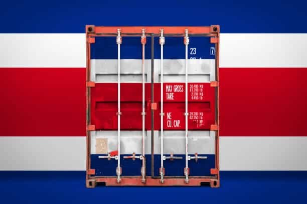 Backside of shipping container painted with Costa Rica flag against national backdrop