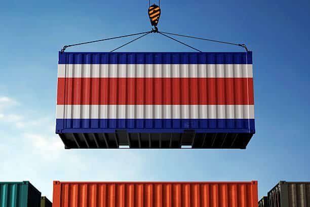 Cargo container painted with Costa Rica flag lifted by crane at shipping port