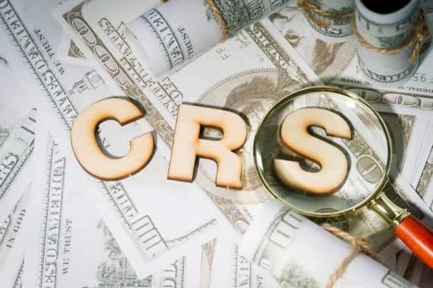 CRS letters on dollar background with magnifying glass highlighting freight cost terminology