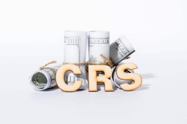 CRS letters in front of rolled-up dollar bills showing freight terminology in shipping charges