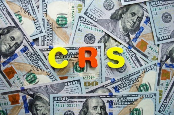Colorful CRS letters over hundred-dollar bills—used in visual comparisons with CFS charges