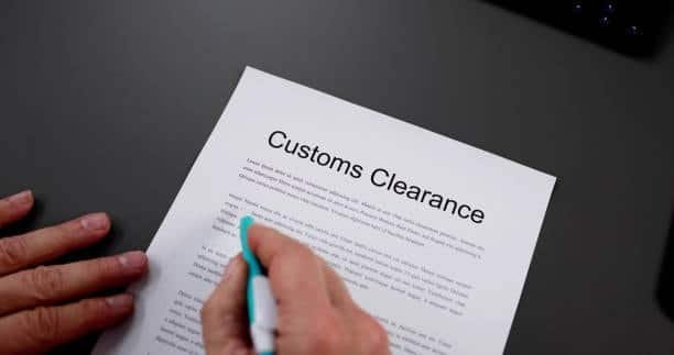 Close-up of a customs clearance form being reviewed