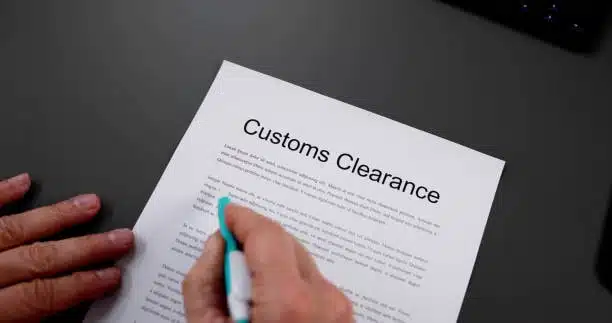 Close-up of a customs clearance form being reviewed