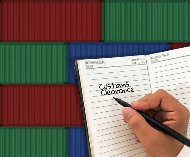 Customs clearance handwritten in journal with containers in background