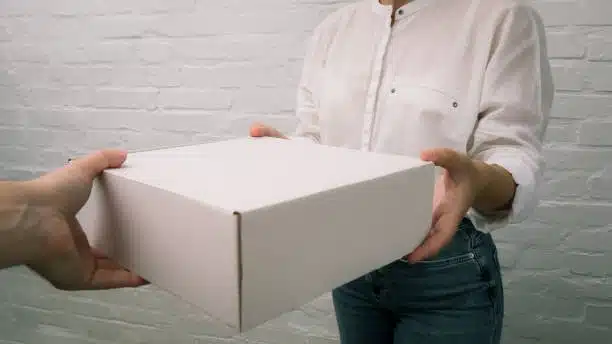 Person receiving parcel directly to home under DDP shipping service