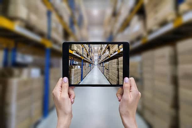Digital tablet used to scan inventory in a warehouse before international shipping