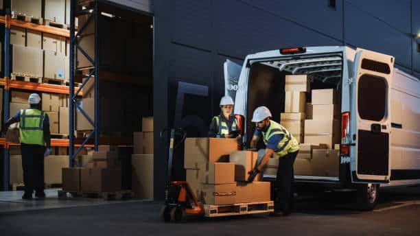 Workers unloading cargo van for door-to-door delivery from China to Somalia