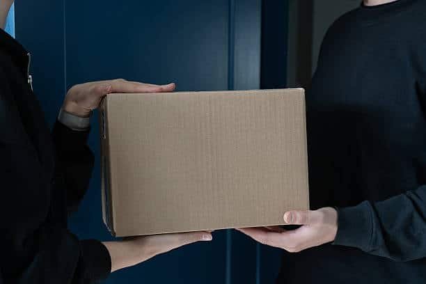 Direct handover of package at doorstep during door-to-door delivery service