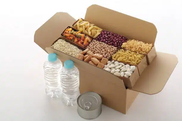 Box containing dry perishable food like beans, pasta, and grains for safe and organized food shipping.