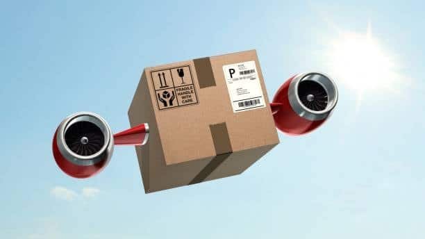 Creative image of a shipping box with attached jet engines flying in the sky, symbolizing express freight