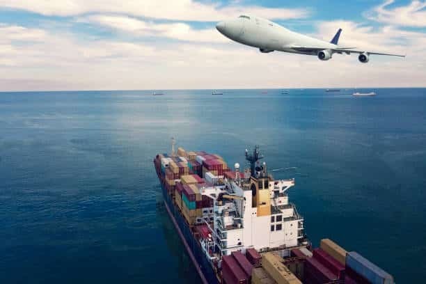 Airplane flying above ocean freighter, visualizing air and sea freight shipping to Mexico.