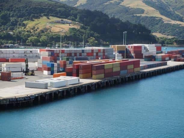 Colorful freight containers at dockyard representing active import and export logistics