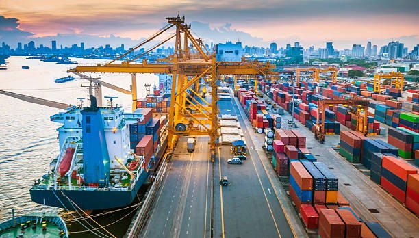 Container port with cranes and cargo ships ready for departure