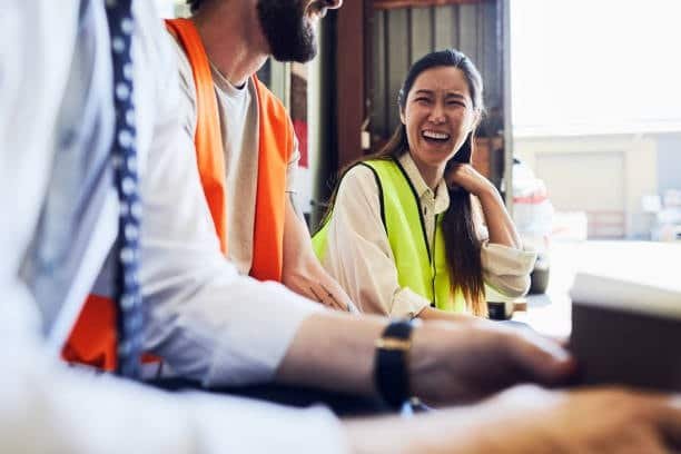 Logistics team communicating and coordinating export freight at warehouse