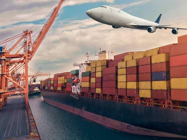 Cargo ship at port with airplane flying above, emphasizing freight forwarding from China to Belgium.