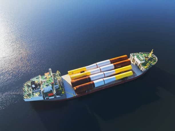 Specialized vessel transporting oversized cylindrical cargo across the ocean, representing heavy cargo ocean freight solutions