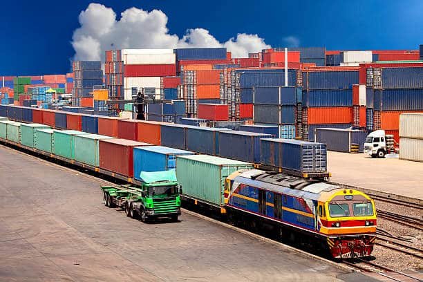 Intermodal terminal with cargo train and truck for freight shipping from China to Spain.