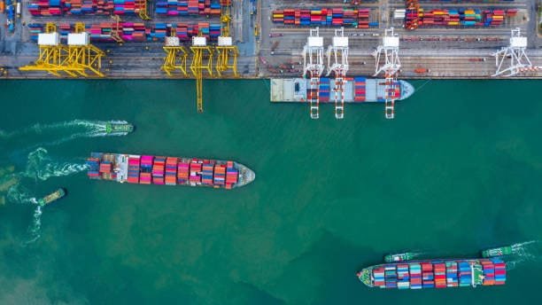 Freight vessels sailing from US port facilities toward Singapore