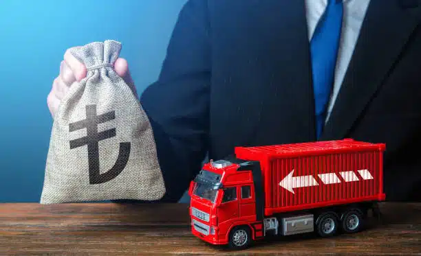 Visual representation of international freight cost control through LCL shipping with miniature cargo truck and currency.