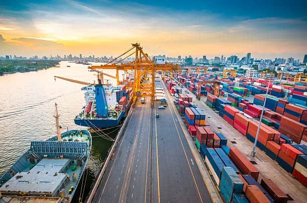 Aerial view of busy Libyan shipping port with cranes and cargo containers