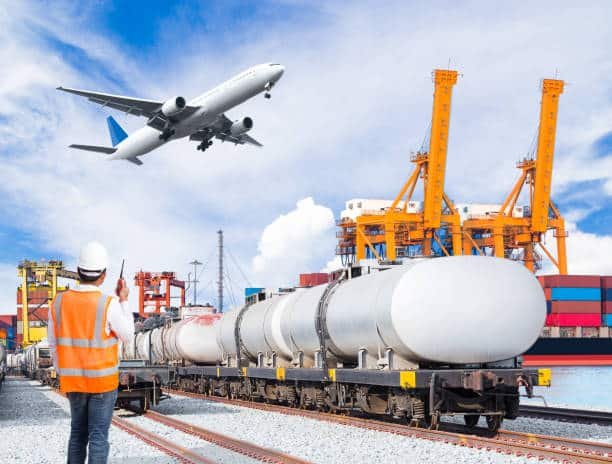 Tanker rail car and airplane at shipping terminal, managed by logistics staff for China to UK deliveries