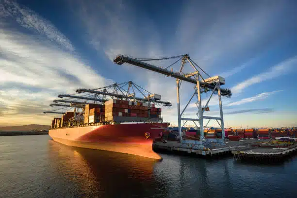 Large cargo vessel at port being loaded for shipment to Italy