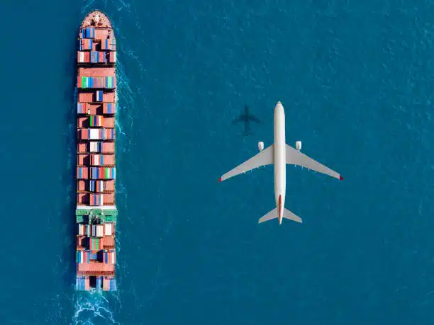 Top view of cargo ship and airplane over ocean, illustrating sea and air freight from China to Algeria