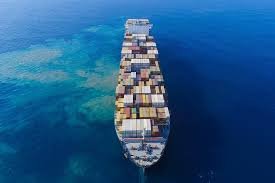 Cargo ship transporting containers across ocean for sea freight from China to Oman