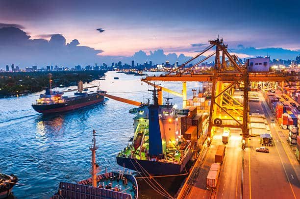 Cargo ships and cranes operating at a busy international port