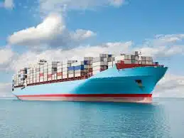 Large ocean container vessel transporting goods from China to Qatar.