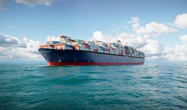 Container ship transporting goods across the ocean as part of global freight logistics