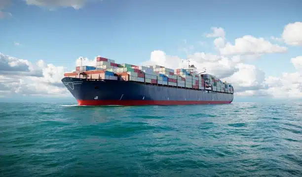 Container ship transporting goods across the ocean as part of global freight logistics