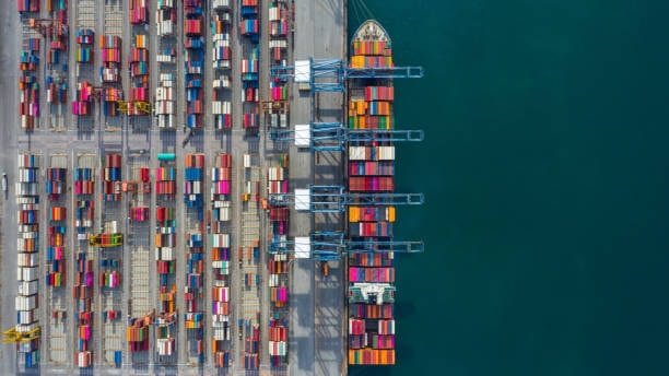 Cargo ship docked at Singapore port unloading goods imported from the United States
