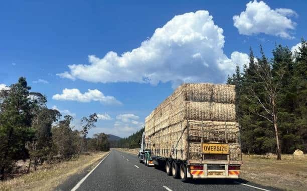 Large freight truck carrying oversize load on Australian highway