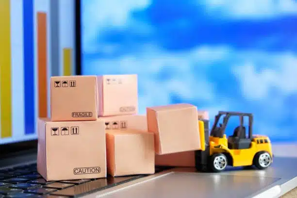 Small packages on laptop symbolizing eCommerce shipping