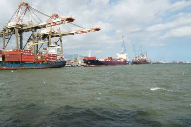 Busy shipping port loading containers for export from China to the UAE.