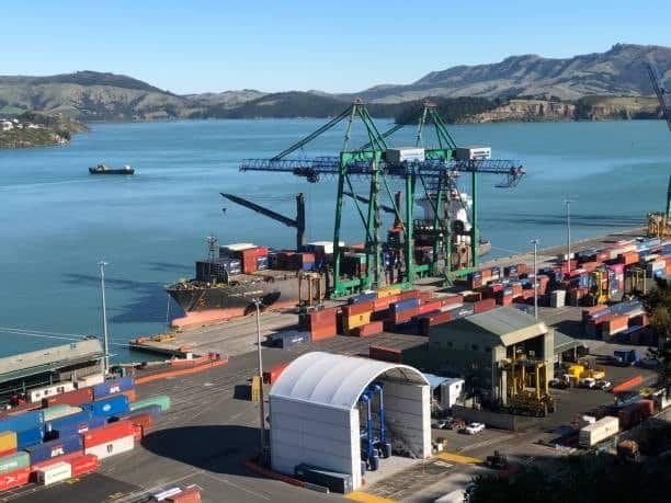Container terminal at Port Otago with cranes and cargo vessels