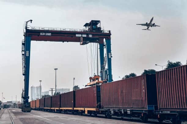 Freight terminal with overhead crane and airplane for air and rail cargo from China to UK