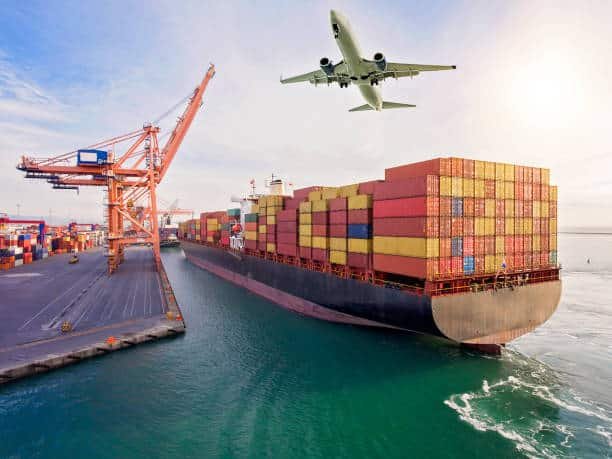 Container ship at port with airplane flying above, symbolizing sea and air freight from China to Sweden.