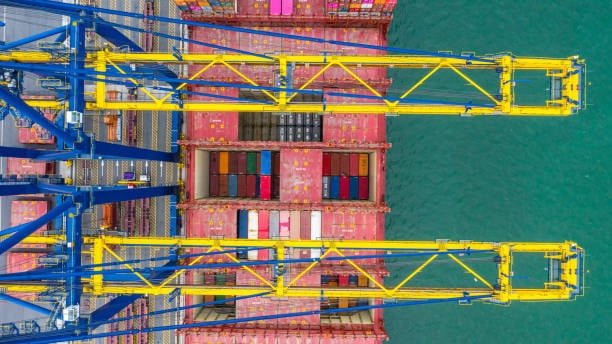 Ship berthing at a Singapore freight terminal to unload international cargo