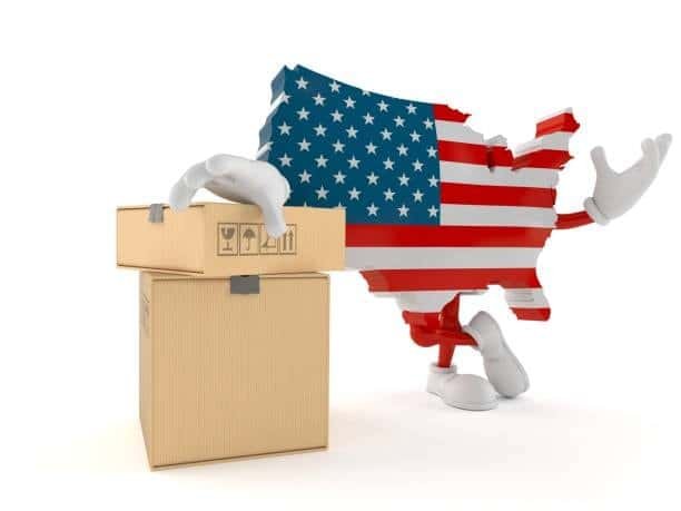 Map of USA holding cardboard boxes ready for international courier delivery