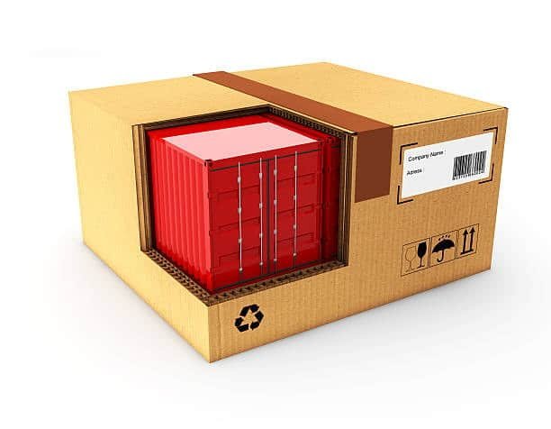 A cargo container model embedded inside a cardboard box, representing scalable freight solutions