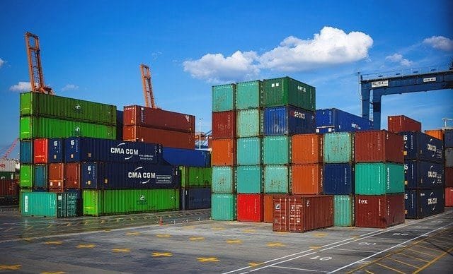 Stacked shipping containers in port, highlighting logistics operations for China–Sri Lanka trade