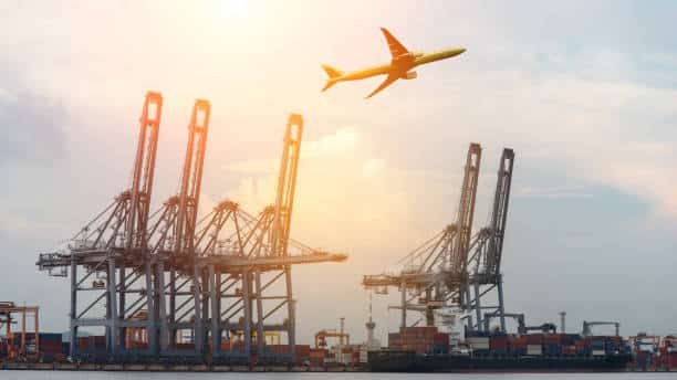 Cargo shipping terminal in Turkey with containers and airplane in the sky representing China to Turkey freight