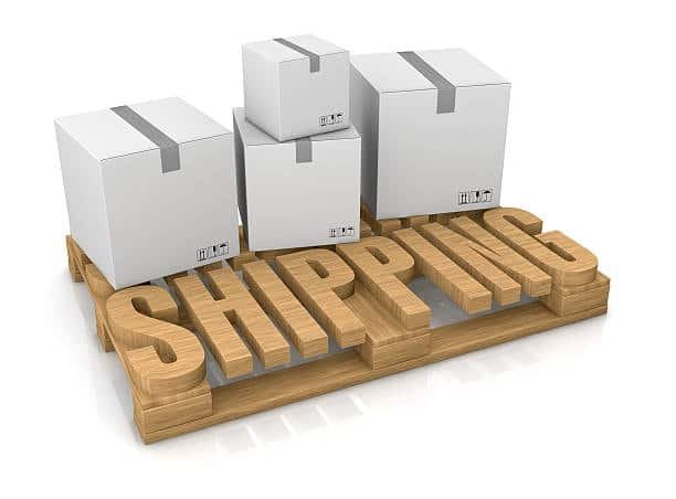Carton boxes stacked on a wooden pallet labeled “SHIPPING” for export logistics