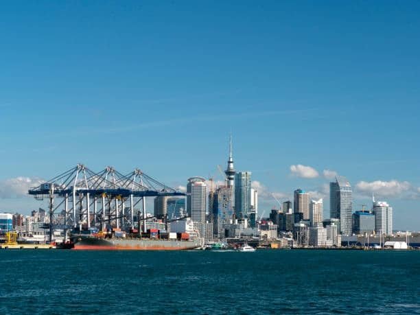 Auckland seaport with container terminal and city skyline in background