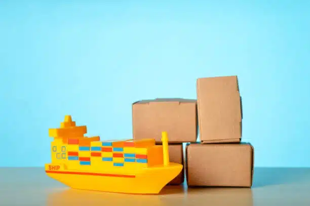 Model ship and cargo boxes for shipping concept