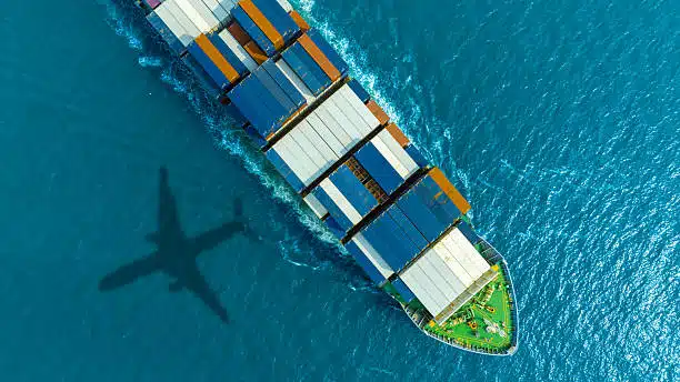 Sea port with cargo ship and airplane representing Turkey import-export logistics