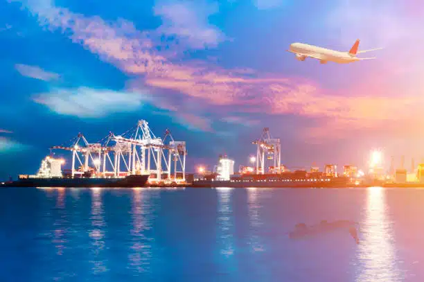 Aerial logistics terminal in Turkey at dusk with aircraft above – emphasizing nighttime cargo shipping from China to Turkey.