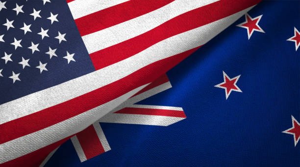 Close-up of American and New Zealand flags representing logistics and shipping cooperation